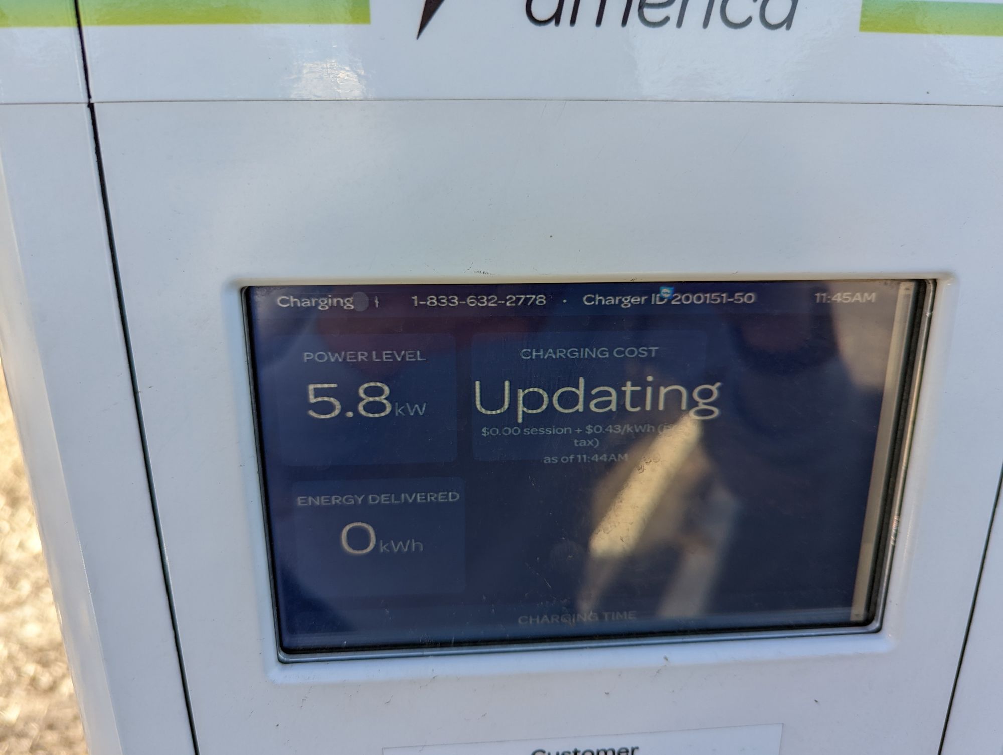Electrify America charger display showing "Updating"